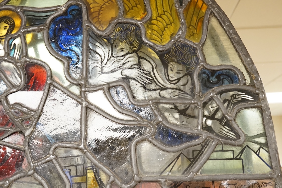 A 20th century semi circular stained glass panel, approximately 80cm wide